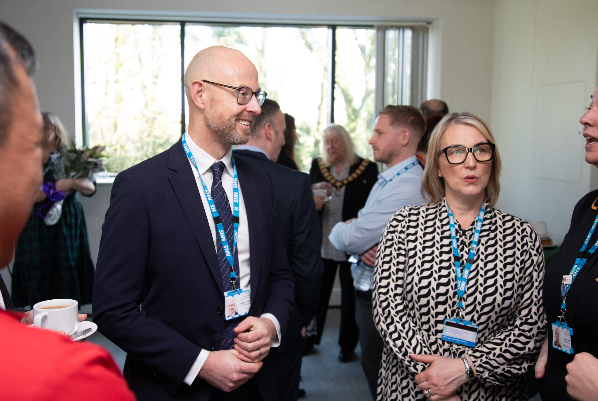 a smiling man and woman talking 