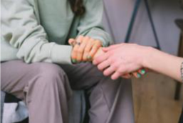 Carer holding someones hand