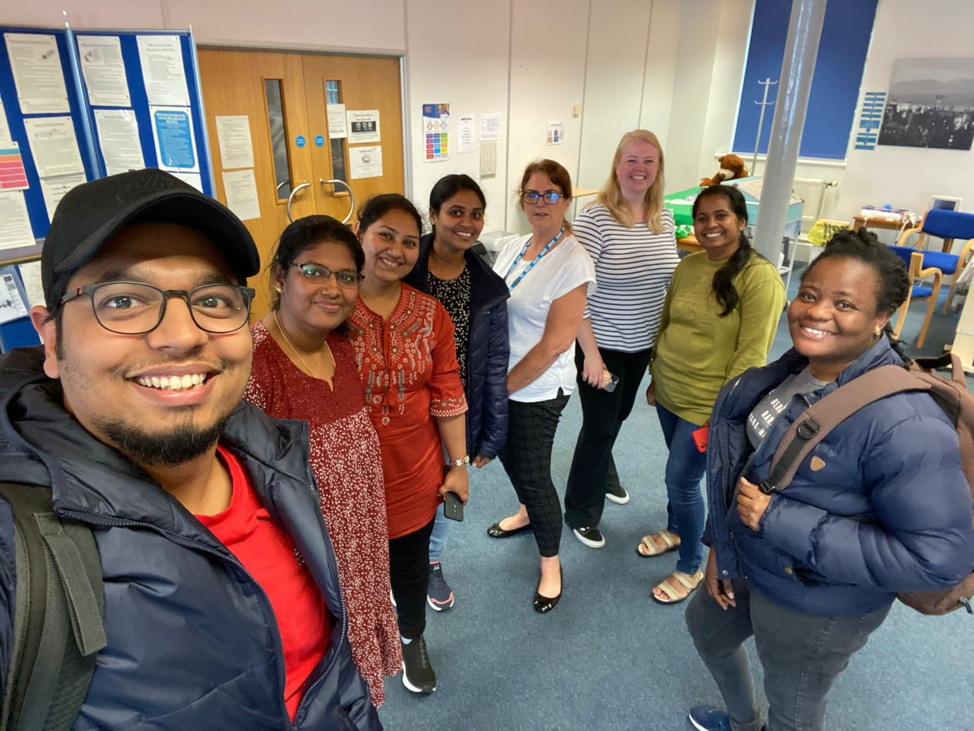 international nurses pose for a selfie