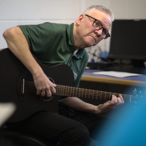 Man playing acoustic guitar