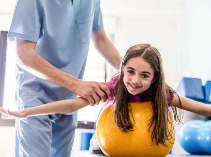 Physio helps child during activity