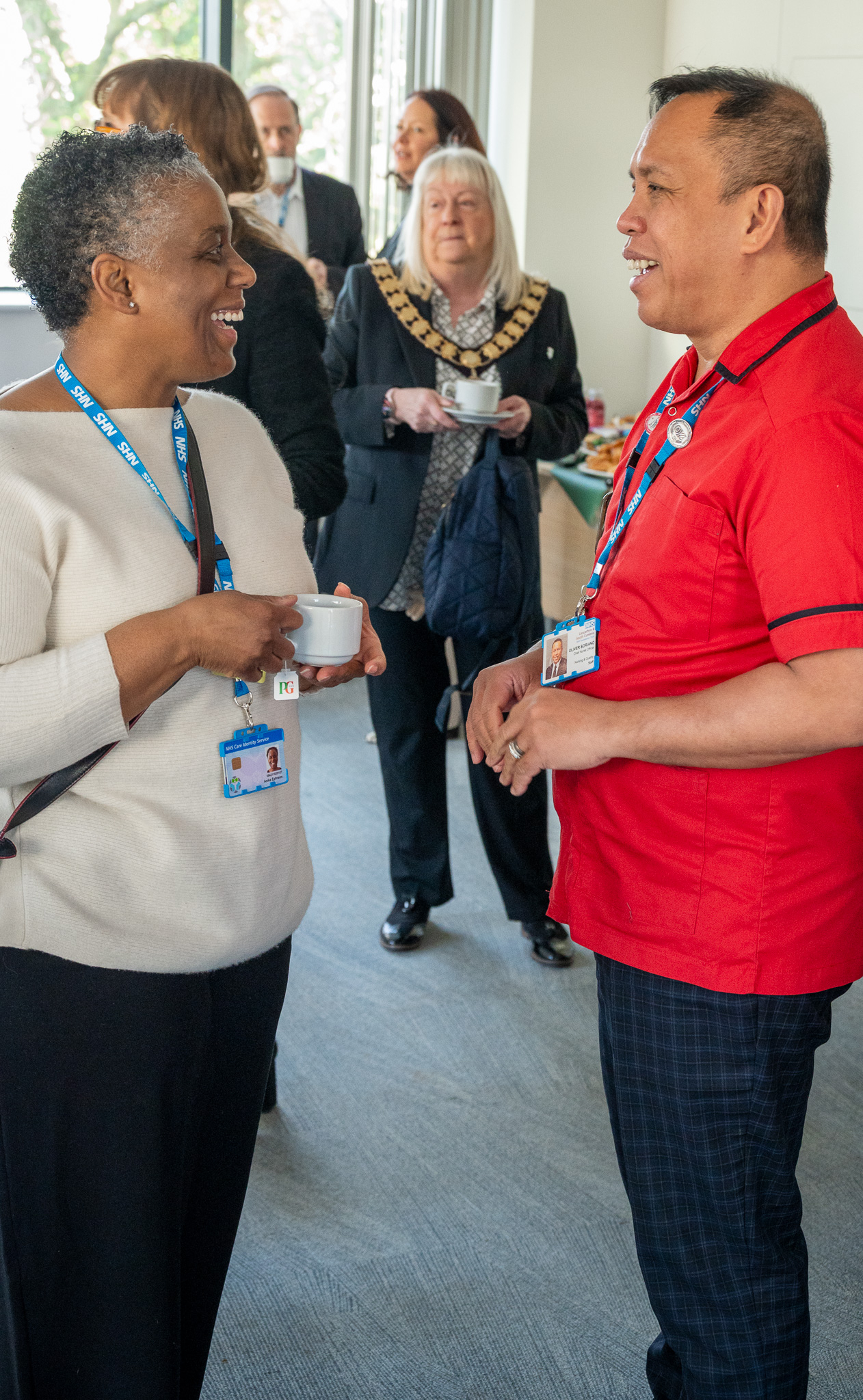 man and woman stood up talking 