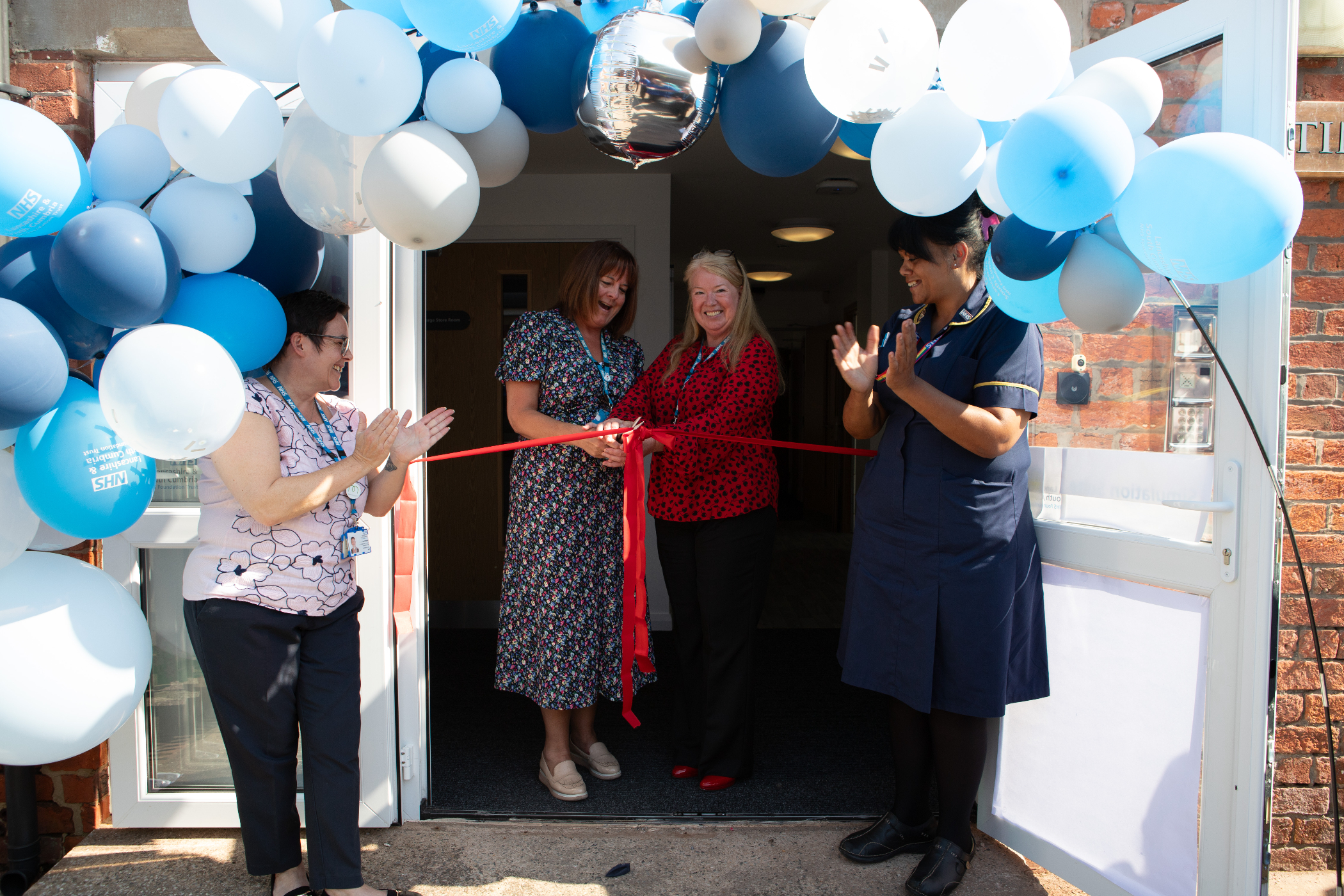 Interim Chief Nurse JulieAnn Murray and Amanda Miskell Associate Chief Nurse cutting ribbon .jpg