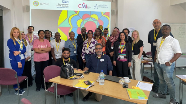 Members of BAME coaching network stand together for a photo.